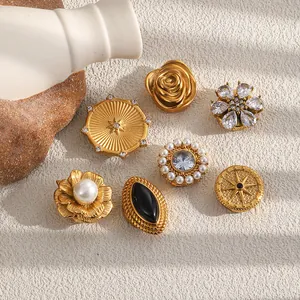 Detail view of vintage 18K gold-plated suit buttons with pearls and crystals