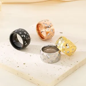 Wide titanium steel rings in four colors featuring a scattered starry sky rhinestone design.