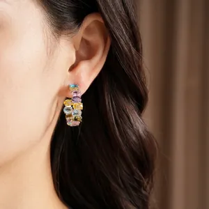 Elegant silver needle hoop earrings featuring vibrant multi-colored oval zirconia stones