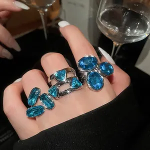 Vintage luxury open ring set with brilliant blue oval crystals and silver plating