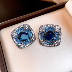 Elegant vintage style flower stud earrings with deep blue zircon and black plating