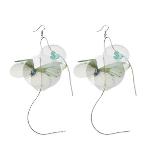 Elegant handmade chiffon butterfly wing tassel earrings with blue flower accents in forest style