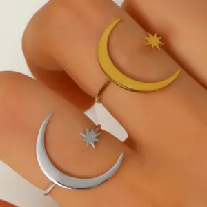Close-up of minimalist stainless steel star and moon open rings in gold and silver finish