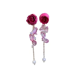 Handmade magenta preserved rose dangle earrings with pink crystal tassels and pearls