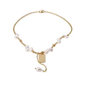 Elegant gold-plated freshwater pearl beaded necklace with an engraved tag pendant