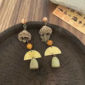 Vintage forest style earrings with wooden beads, acorn caps, and metal maple leaf