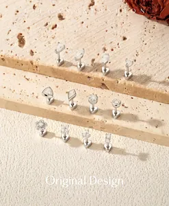 Detailansicht verschiedener Moissanit S925 Silber Ohrstecker mit Schraubverschluss auf Stein