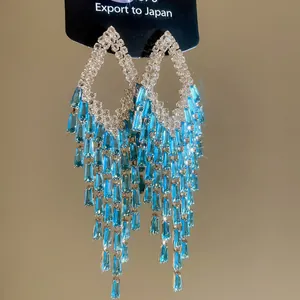 Elegant blue zircon jellyfish tassel earrings in silver finish with sparkly rhinestones