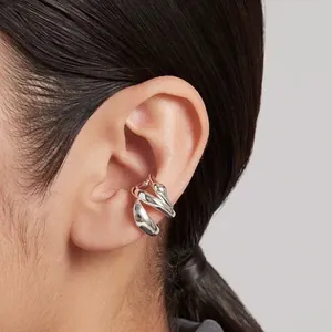 Minimalist 316 stainless steel geometric ear cuff in polished silver finish.