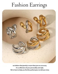 Display of chunky twisted geometric ear cuffs in gold, silver, and two-tone finishes.