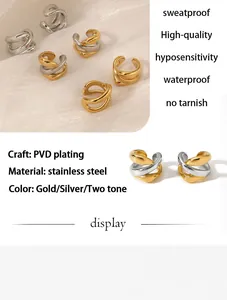 Detail view of PVD plated stainless steel geometric ear cuffs in gold and silver tones