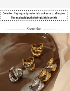 Detail view of geometric 316 stainless steel ear cuffs in gold and silver finishes