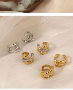 Detailed view of geometric stainless steel ear cuffs in gold, silver, and mixed tones