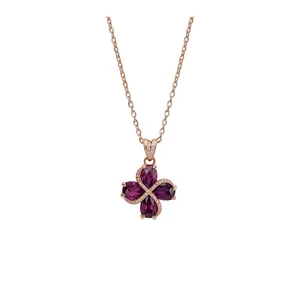 Elegant rose gold flower pendant necklace with purple zircon stones on white background