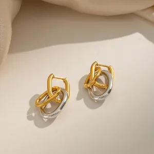 Two-tone interlocking oval hoop earrings in gold and silver stainless steel