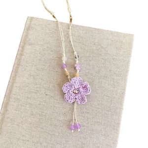 Elegant handmade lavender crochet flower necklace with beaded details for summer resort style