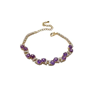 Elegant gold bracelet with purple cubic zirconia stones in French vintage style
