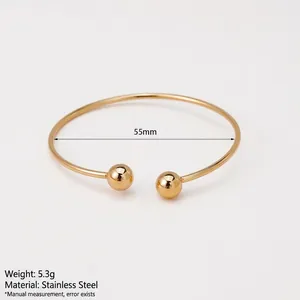 Bracelet jonc ouvert en acier inoxydable plaqué or avec extrémités à billes rondes