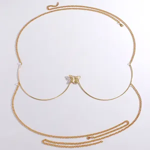Exquisite detail of a vintage hollow butterfly charm on a gold-tone metal chest chain jewelry