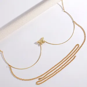 Detailed view of a gold-toned butterfly chest chain with hollow butterfly pendant