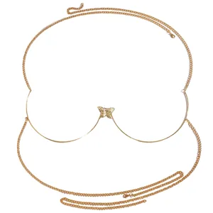 Detailed macro view of a gold retro butterfly body chain for beach bikini outfits.
