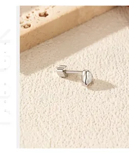 Macro view of heart-shaped Moissanite stud earring in S925 silver with screw back