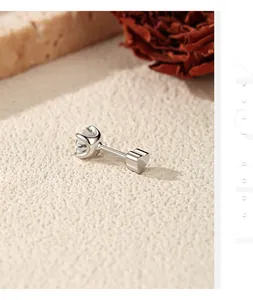 Macro detail of S925 silver moissanite stud earring with a heart-shaped screw back