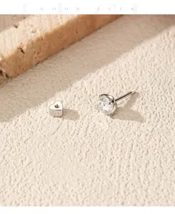 Detail view of S925 sterling silver moissanite stud earring with heart-shaped screw-back closure