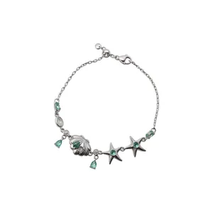 Exquisite silver-tone bracelet featuring teal gemstone starfish and seashell charms for women