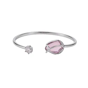 Korean style silver open bangle featuring a pink cat-eye stone flower and zircon accents