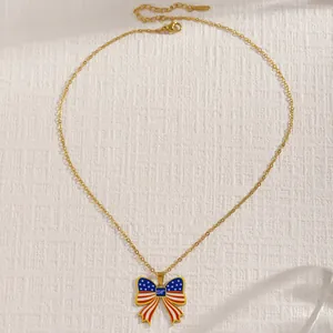 Detailed shot of a gold necklace with a 250th anniversary US flag themed bow-shaped pendant