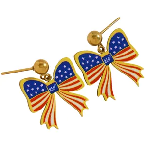 Close-up detail of 250th anniversary American flag bow stud earrings with gold plating