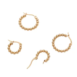 Chic gold-plated beaded hoop earrings in various sizes with a secure clasp closure