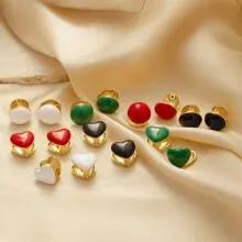 Close-up of heart and round earrings in 18K gold-plated steel with multi-color enamel detail