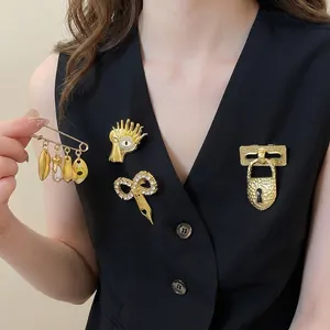 Unique gold metal brooch set with surrealist designs and zircon accents for women