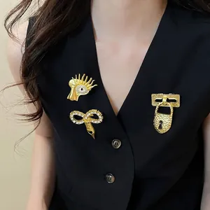 Set of vintage gold zircon brooches with unique artistic designs on a black vest