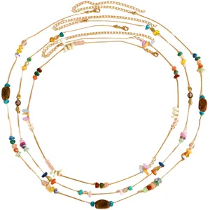 Close-up of retro ethnic waist chain with colorful irregular crushed stones and gold beads