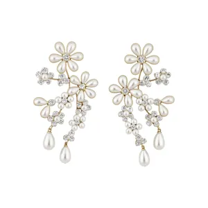 Elegant floral pearl earrings with shimmering rhinestones in a gold-tone finish.
