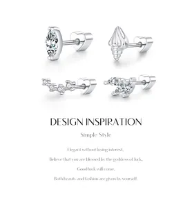 Macro view of four moissanite silver studs showing diverse elegant designs and details.