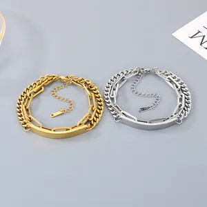 Detailed view of gold and silver double-layer chain bracelets with engravable plates