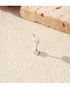Close-up of a marquise-cut moissanite silver earring with heart-shaped back