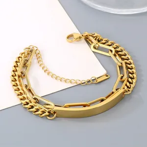 Close-up of gold double-layer titanium steel bracelet with blank engravable curved plate