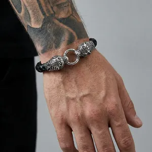 Retro punk men's braided leather bracelet featuring vintage silver dragon head ornaments