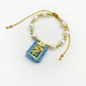 Religious vintage bracelet featuring natural pearls and a Virgin Mary pendant detail