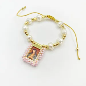Handmade religious natural pearl beaded bracelet featuring a Virgin Mary gold pendant detail
