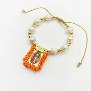 Detailed view of handmade religious bracelet with natural pearls and Guadalupe charm