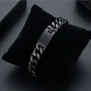 Detail of matte black cuban chain link bracelet for men on velvet display cushion
