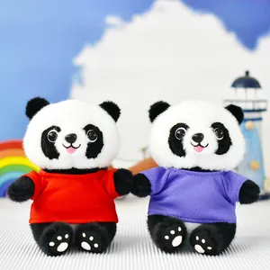 Close-up of two cute panda plush toys wearing red and purple T-shirts