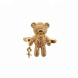 Elegant gold bear ear cuff featuring sparkling crystals and a dainty dangling star charm