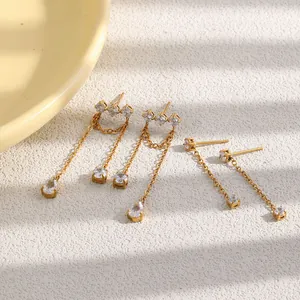 Close-up detail of elegant 18K gold plated stainless steel tassel earrings with zircon stones